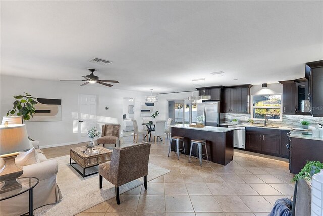 2461 61st Ln N, Saint Petersburg, FL 33710 - living area featuring a ceiling fan and light tile patterned floors