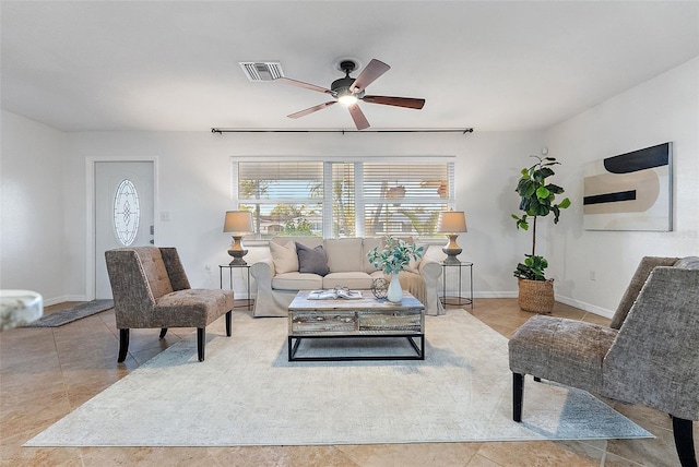 tiled living room with ceiling fan