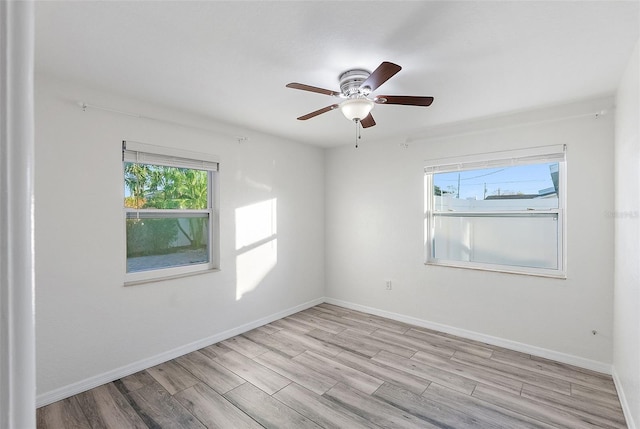 unfurnished room with light hardwood / wood-style flooring and ceiling fan