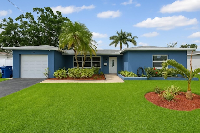 2461 61st Ln N, Saint Petersburg, FL 33710 - ranch-style home with stucco siding, a front yard, a garage, and driveway