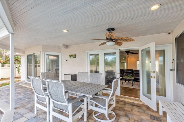 exterior space with ceiling fan