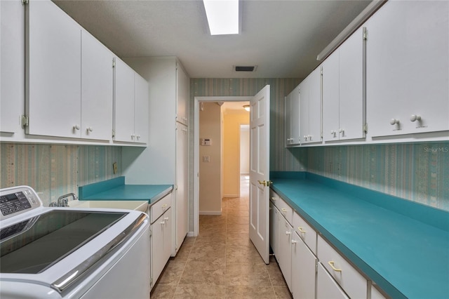 washroom featuring cabinets