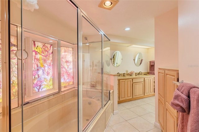 bathroom featuring tile patterned flooring, vanity, and bath / shower combo with glass door