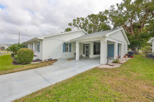 view of front of house featuring a front yard and central air condition unit