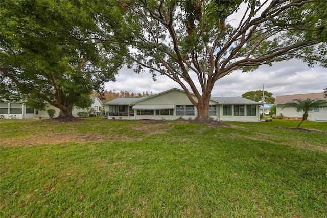 back of house with a yard