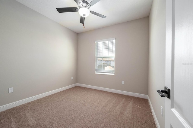 carpeted empty room with ceiling fan