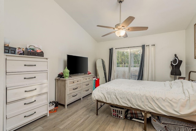 bedroom featuring vaulted ceiling, light hardwood / wood-style flooring, and ceiling fan