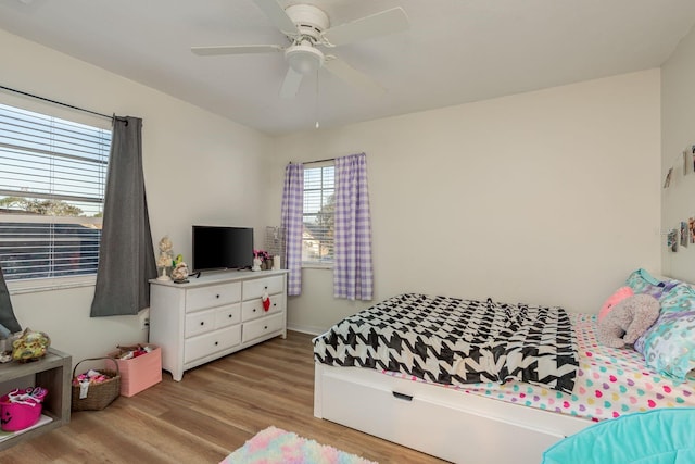 bedroom featuring ceiling fan and light wood-type flooring