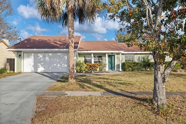 single story home featuring a front yard and a garage