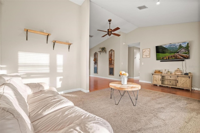 living room featuring carpet flooring, ceiling fan, and lofted ceiling