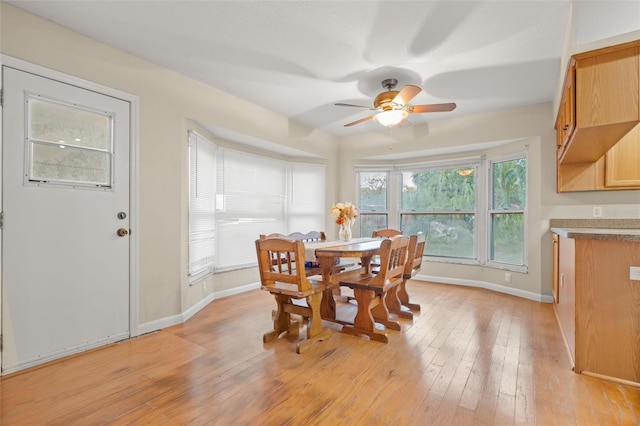 dining room featuring ceiling fan and light hardwood / wood-style floors