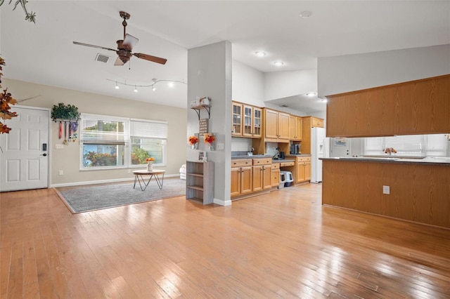 kitchen with white refrigerator with ice dispenser, light hardwood / wood-style floors, high vaulted ceiling, and ceiling fan