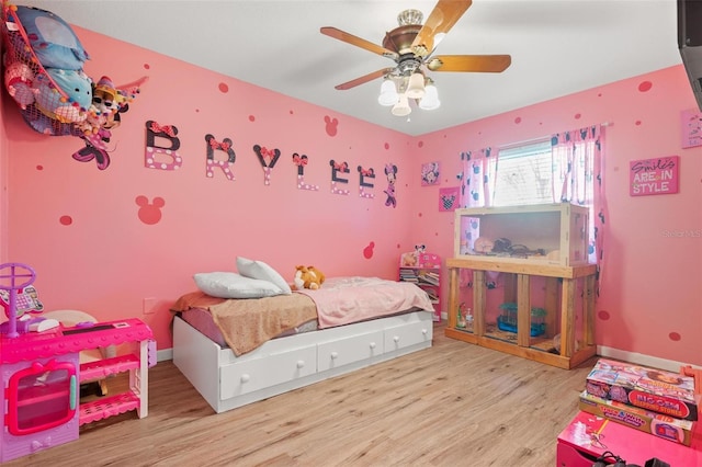 bedroom with light wood-type flooring and ceiling fan