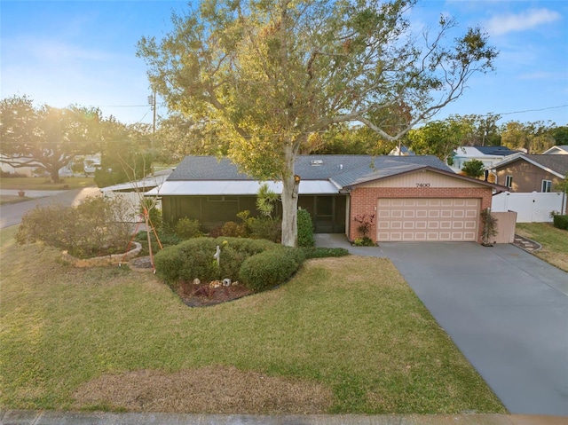 view of front facade featuring a front lawn and a garage