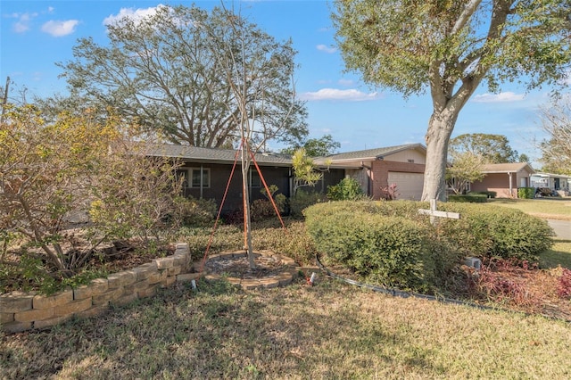 single story home with a garage