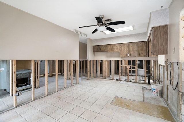 interior space featuring ceiling fan and light tile patterned flooring