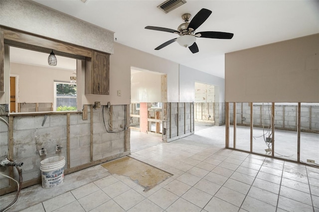 interior space with ceiling fan and light tile patterned floors