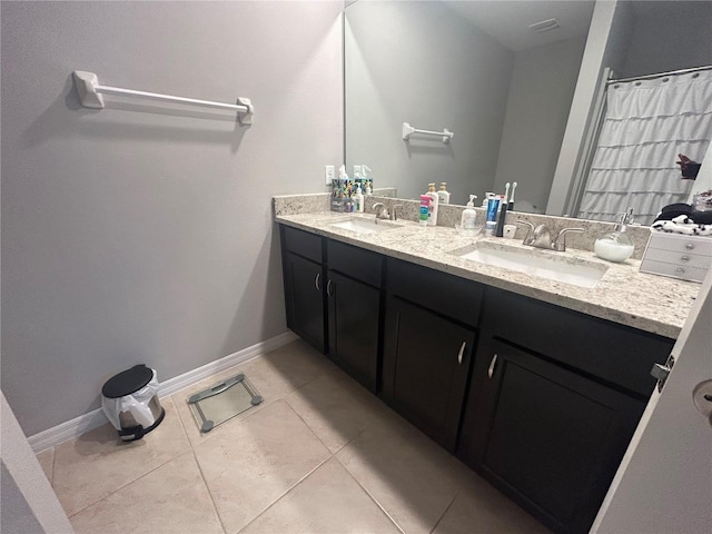 bathroom with vanity and tile patterned floors