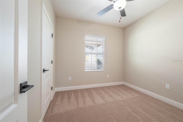 carpeted empty room with ceiling fan