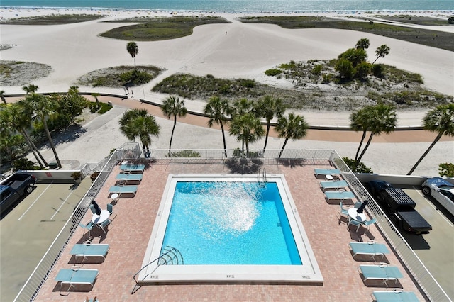 view of swimming pool with a water view