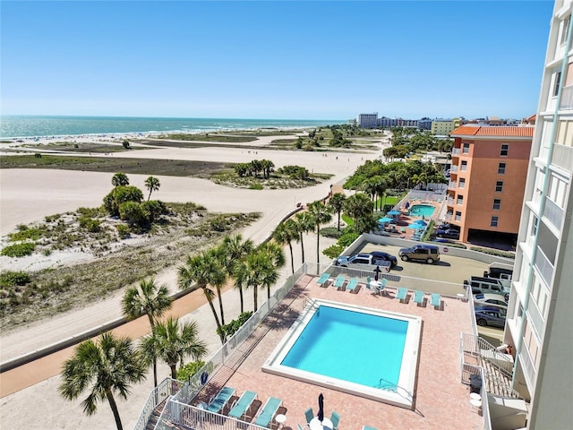 view of pool featuring a water view