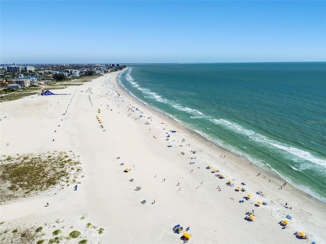 bird's eye view featuring a view of the beach and a water view