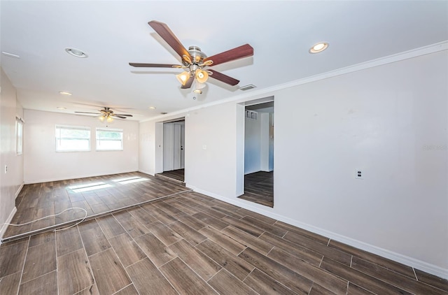 unfurnished room with crown molding, ceiling fan, and dark hardwood / wood-style floors