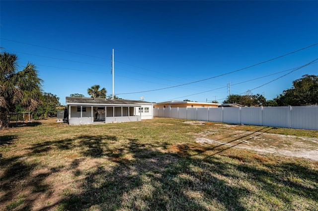 view of yard with a sunroom