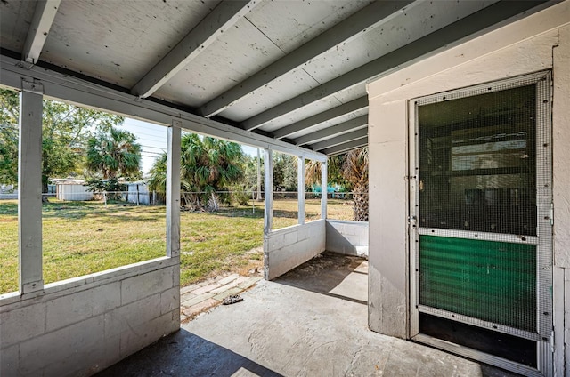 unfurnished sunroom featuring a healthy amount of sunlight