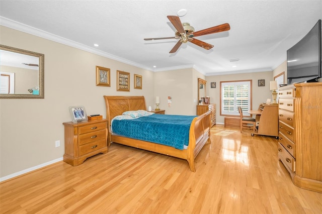 bedroom with a textured ceiling, ornamental molding, ceiling fan, and light hardwood / wood-style flooring