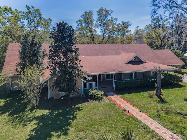 view of front of house featuring a front lawn and covered porch