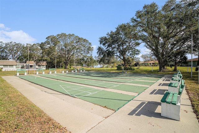 view of home's community featuring a lawn