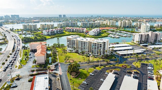 drone / aerial view featuring a water view and a city view