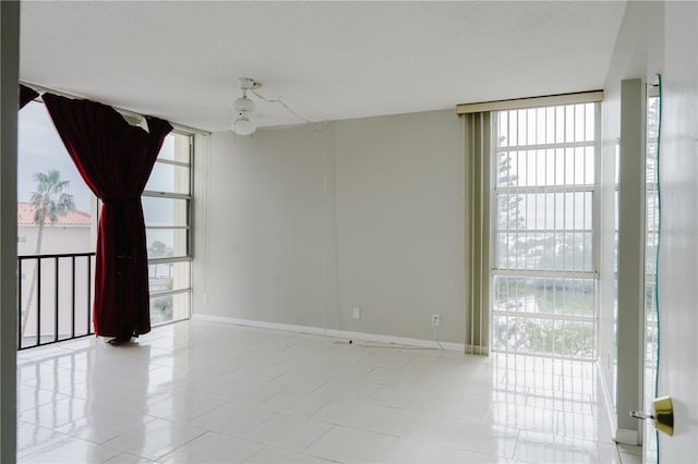 spare room featuring floor to ceiling windows