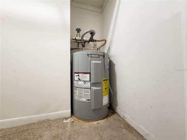 utility room featuring water heater