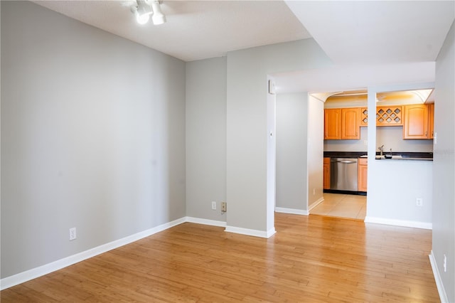 unfurnished living room featuring light wood-type flooring