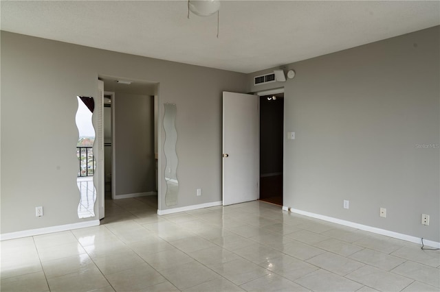 empty room with light tile patterned floors