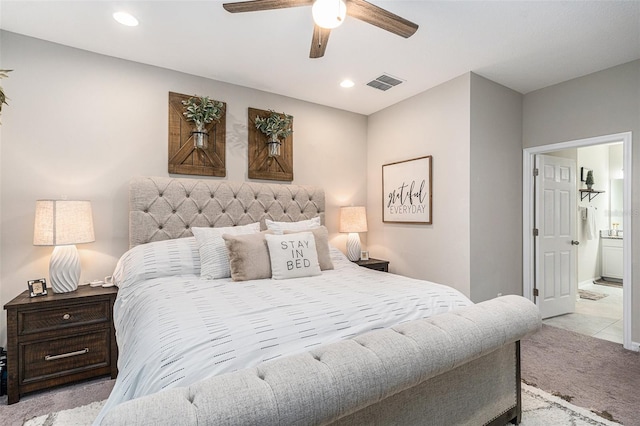 carpeted bedroom with ceiling fan, visible vents, ensuite bathroom, and recessed lighting