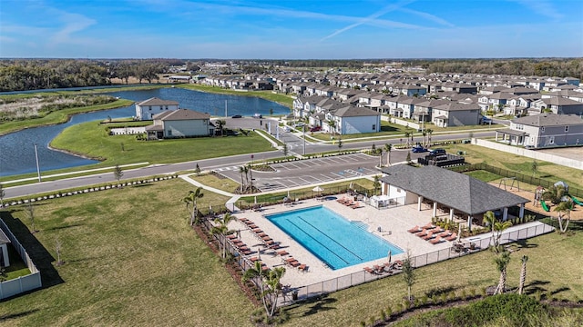 aerial view featuring a water view and a residential view