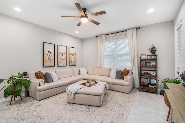 living area with light tile patterned floors, ceiling fan, and recessed lighting