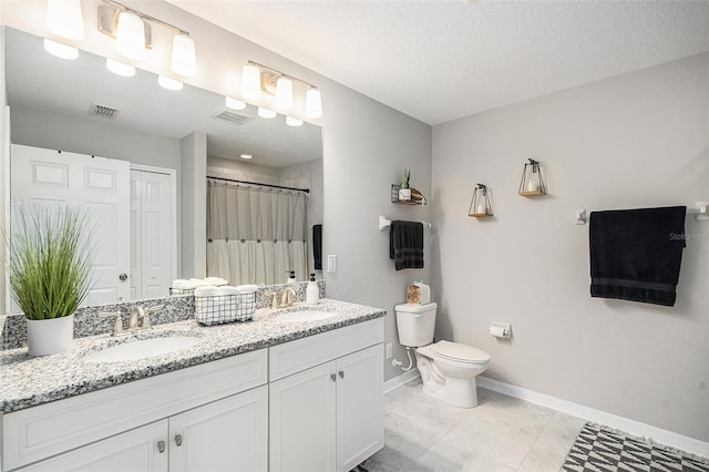 bathroom with visible vents, a sink, toilet, and baseboards