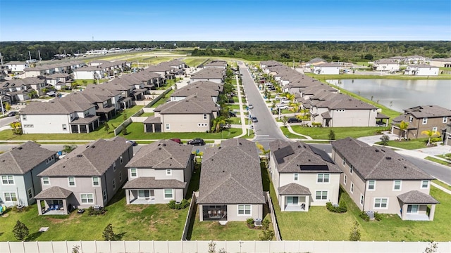 birds eye view of property featuring a residential view and a water view