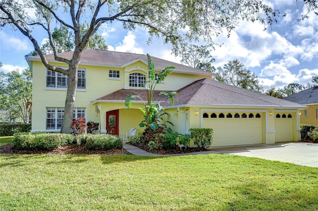 view of front facade featuring a front yard and a garage