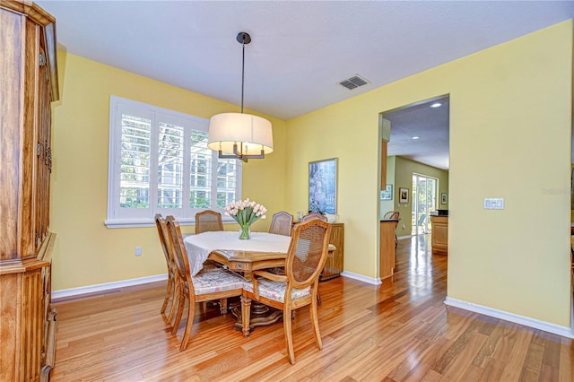 dining room with light hardwood / wood-style floors