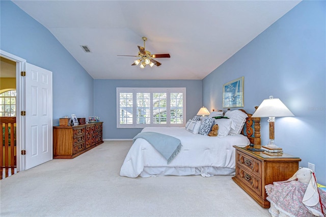 carpeted bedroom featuring ceiling fan and vaulted ceiling