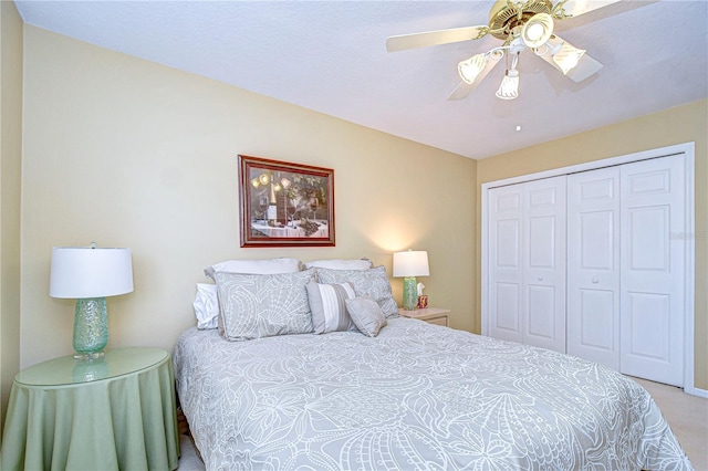 bedroom with carpet flooring, ceiling fan, and a closet