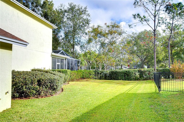 view of yard featuring glass enclosure