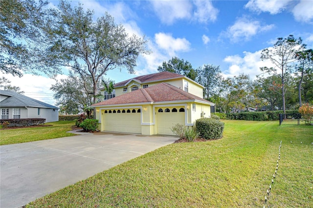 view of side of property featuring a lawn and a garage