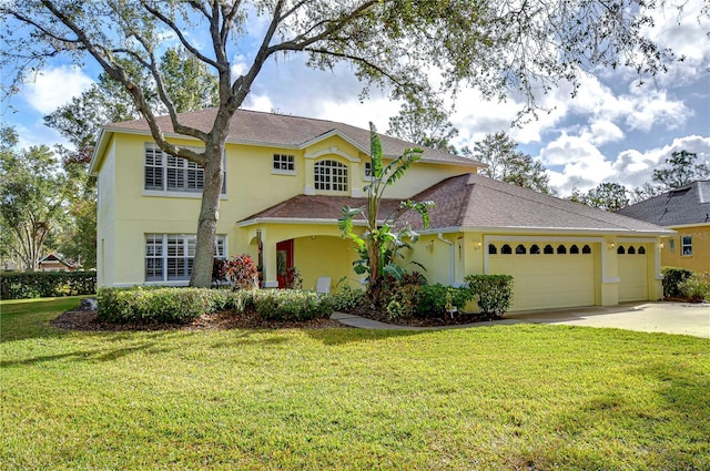 view of front of house with a garage and a front lawn