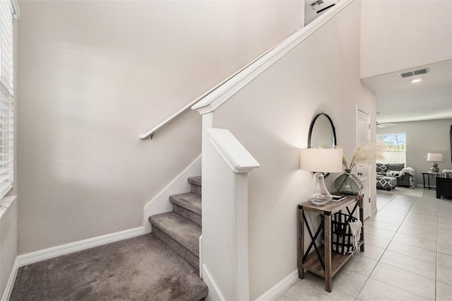 staircase with tile patterned floors